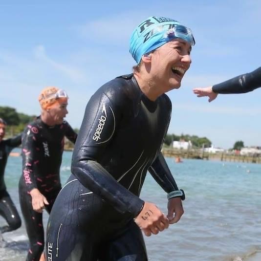 Coach Karen exiting the water at the River Arun swim