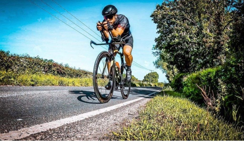 Coach Carl in full racing mode on his bike